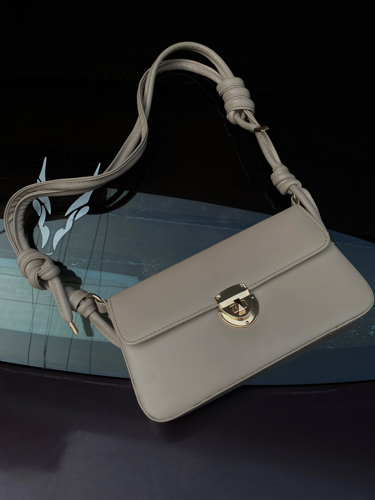 Skin-coloured structured knot bag for women by Charmé