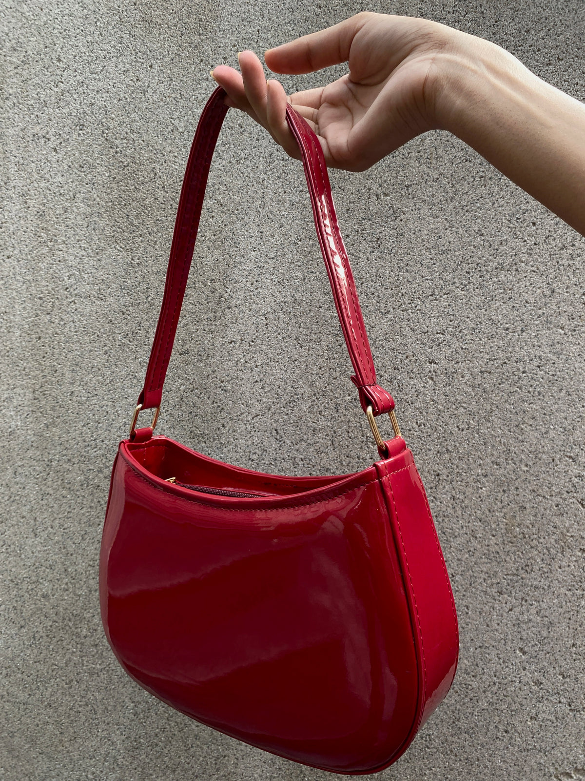 Cherry red curved shoulder bag for women by Charmé